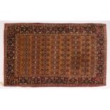 A GOOD KASHAN RUG first half 20th Century, beige ground with seven rows of seven stylized palmettes,