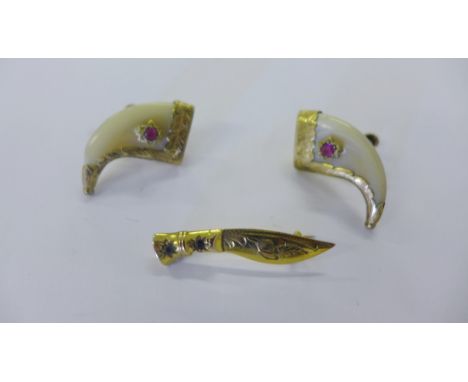 9ct gold foliate engraved dagger brooch set with sapphires together with pair of yellow metal mounted tooth earrings (2)