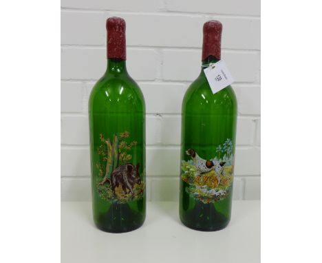 A pair of decorative green glass wine bottles each with a printed enamel pattern depicting a hunting hound and boar (2) 36cm 