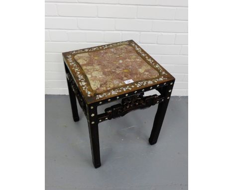 A Chinese rosewood marble topped table having a mother of pearl floral inlay raised on square supports, 42 x 53cm