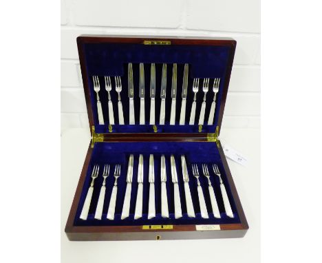 George V mother of pearl and silver fruit knives and forks for a twelve place setting, with maker's marks for Isaac Ellis & S