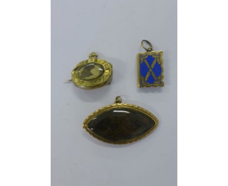 Two 19th century hair plaid mourning brooches, each set in yellow metal frames together with a Victorian yellow metal and blu