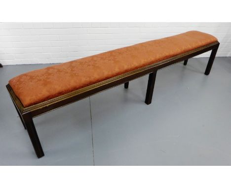 A 19th mahogany hall bench by John Taylor & Sons, Edinburgh having a padded insert seat upholstered in a rose floral fabric r