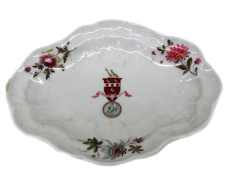 A Chamberlain Worcester armorial shaped oval dish, circa 1815, painted in the centre with a coat of arms and the motto 'Verit