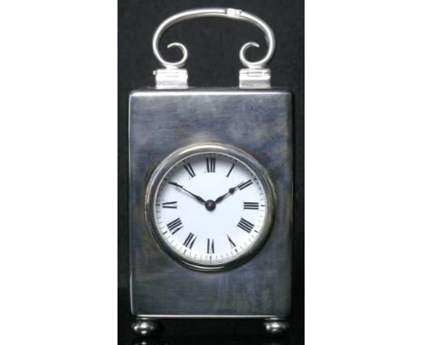 A late Victorian silver cased carriage timepiece, William Comyns, London 1900, the plain rectangular case with a hinged scrol