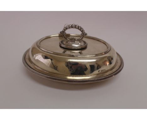 An Edwardian oval silver entree dish, William Hutton & Sons, London 1903, with beaded borders and detachable handle, 27cm wid