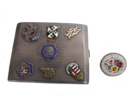 A 1930's continental silver cigarette case, applied with silver, gold and enamel shields, 6ozs, 10.5 x 8.2cm and a gilt metal