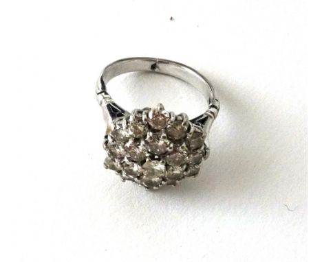 A diamond cluster ring, the nineteen brilliant-cut stones approx. 2.85cts total weight, claw-set in white metal, stamped PLAT