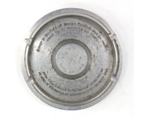 An ashtray converted from a WWII RAF Rolls Royce Merlin engine piston, engraved with Churchill's Battle of Britain quote "Nev