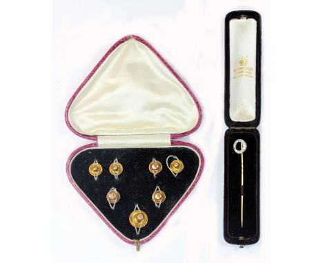 An early 20th century gold and diamond 'winning post' stick pin, the white gold circlet grain and millegrain set with single-