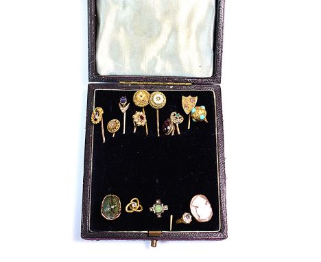 A collection of 15 various stick pins, including gem set examples, comprising, an oval shell cameo depicting a neo-classical 