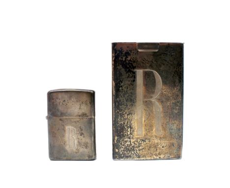 An Art Deco sterling silver cigarette packet sleeve, rectangular with hinged cover, 9cm long, inscribed and a sterling silver
