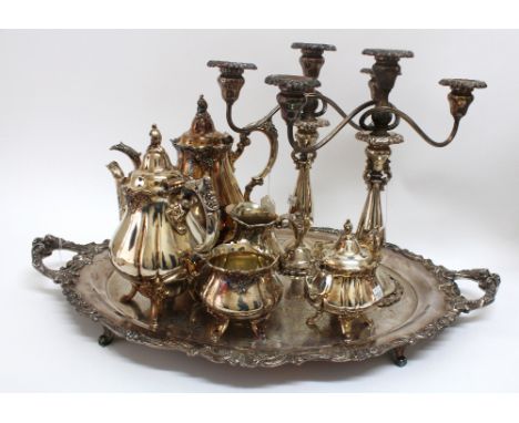 An American large oval two handled tea tray, Baroque by Wallace, with acanthus, bead, leaf scroll and floral handles and bord