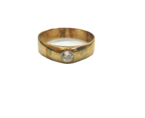 An early 20th century diamond solitaire gypsy ring, the old cut stone approximately 0.25cts, indistinctly stamped '585', ring
