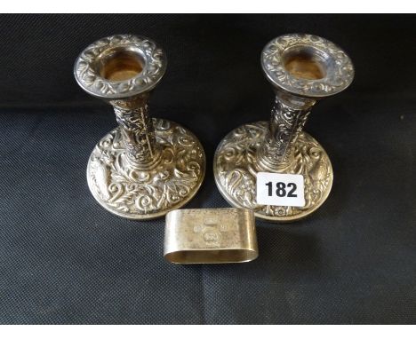 Pair of Silver foliate embossed candlesticks Birmingham 1972 and a Silver Napkin Ring, Condition - some light denting