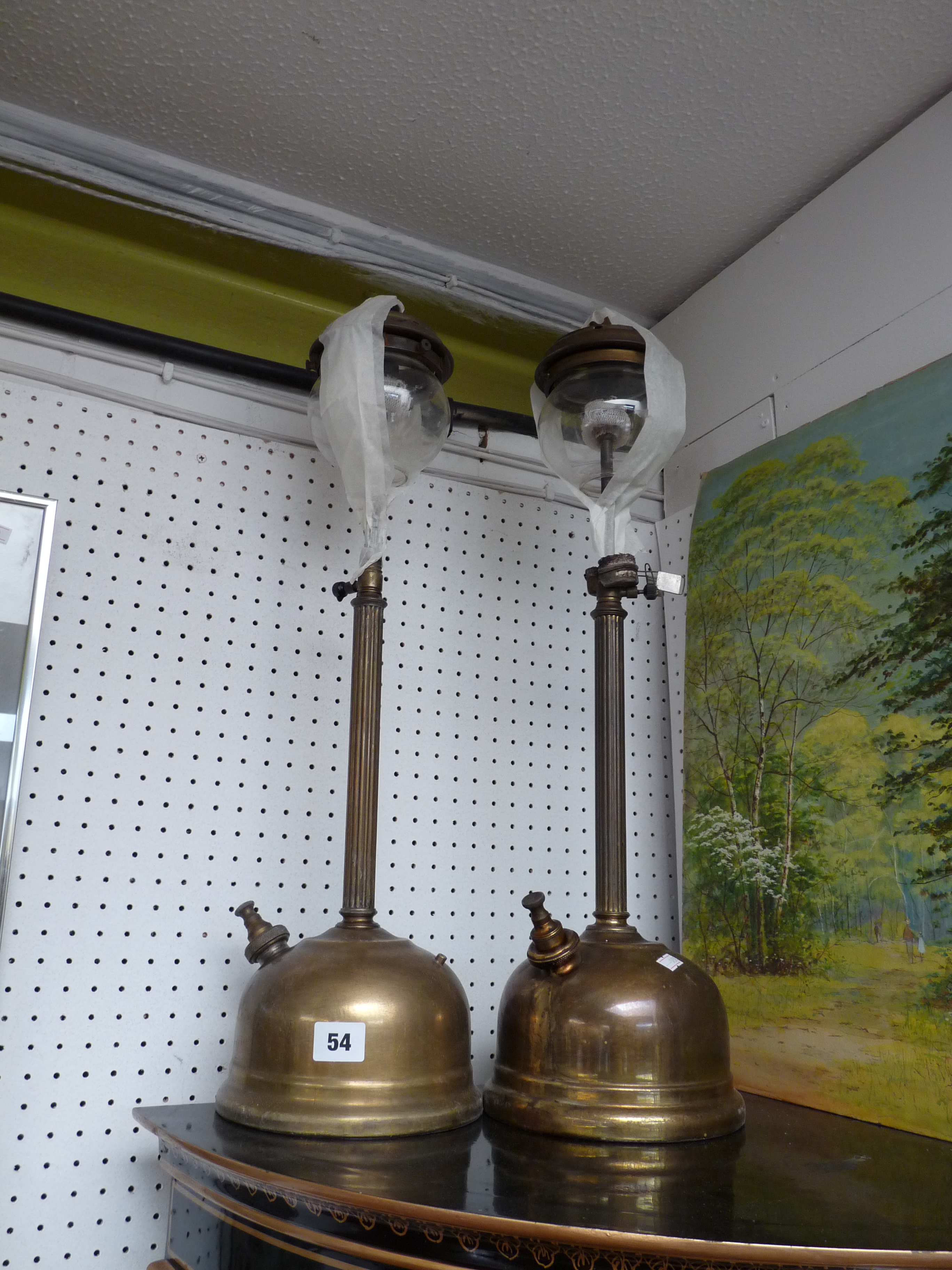 Pair of Edwardian tall paraffin lamps with glass globes and adjustable stem