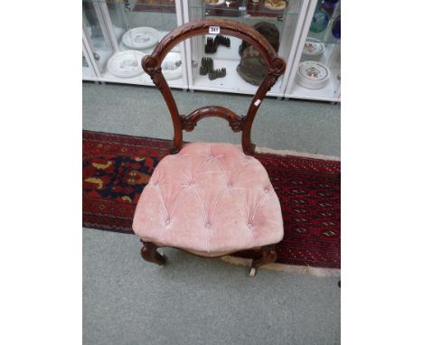 Victorian Walnut carved chair with pink button back seat on curved French legs on caster feet, Condition - Staining to seat a