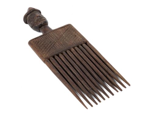 A West African carved wooden comb