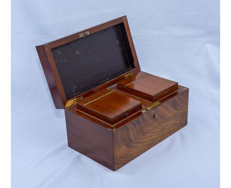 A mahogany tea caddy