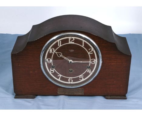An oak mantle clock