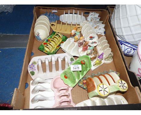 A collection of ceramic toastracks including Beswick 'Ballet', Beswick Ware 'Lettuce and tomato', The Seven Dwarves, Royal Wi
