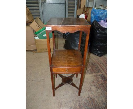A Georgian Oak campaign Washstand, the square legs united by a lower shelf and a drawer and a cross stretcher with a central 