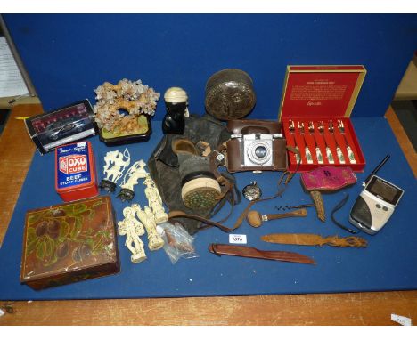 A box of miscellanea including collectable vintage tins, Spode pickle forks, Gemtree, a camera, WWII gas mask etc.