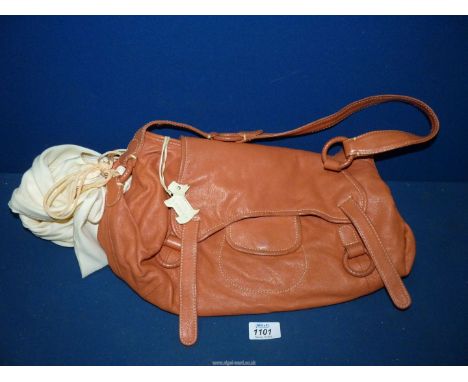 A light tan leather Radley Handbag with dog tag, charms and dustbag.