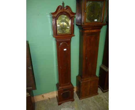 A contemporary Mahogany and Walnut cased Grandmother Clock having a mirrored scroll pediment with a central turned finial, bl