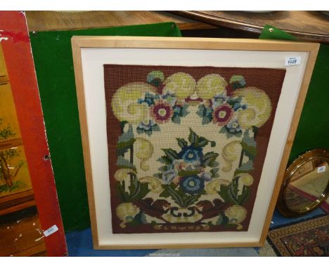 A framed Tapestry of stylized flowers, 23" wide x 28" overall.