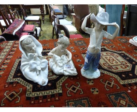 Three Nao child figures 'My Blanky!', 'All Bundled Up' (a/f.) and 'Big Hat' cowboy