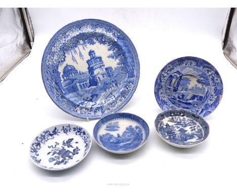 A blue and white willow pattern plate and four saucers including Copeland, Rogers or Bevingtons etc.