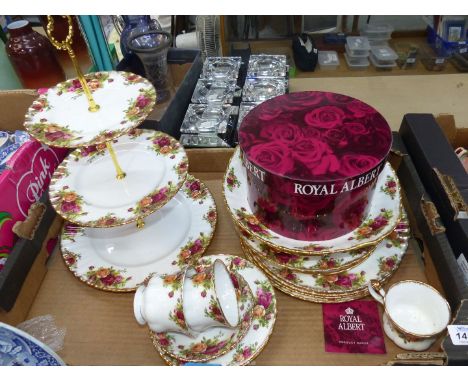 A quantity of Royal Albert "Old Country Rose" to include: a cake stand, three cups and saucers, a lidded sugar bowl, etc.