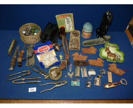 A quantity of miscellaneous to include: nut crackers, marbles, an old brown glass "Bovril Limited" bottle, etc.