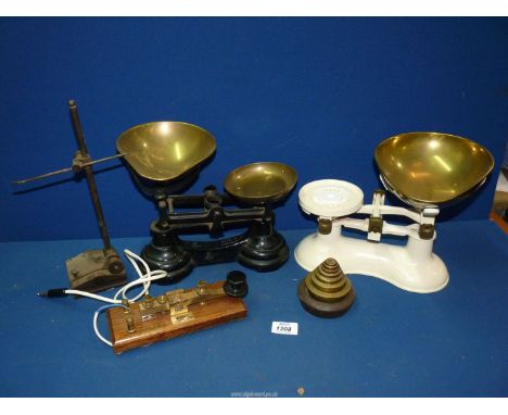 Two weighing/balance scales (one with set of  brass weights), a Morse code tapper/key by Kent of Preston and a laboratory sta