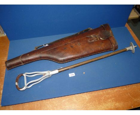 A leather 'leg of mutton' gun case by W. Ritchards Liverpool, initialled H.W.B., together with a 'Tirion' shooting stick.