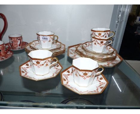 A Wedgwood Etruria part tea set in octagonal shape,with orange and gilt swag decoration including five cups, six saucers, six