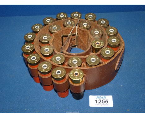 A leather cartridge belt with 25 of 12 bore cartridges.****ALL WEAPONS AND/OR AMMUNITION MUST BE COLLECTED IN PERSON - NO POS