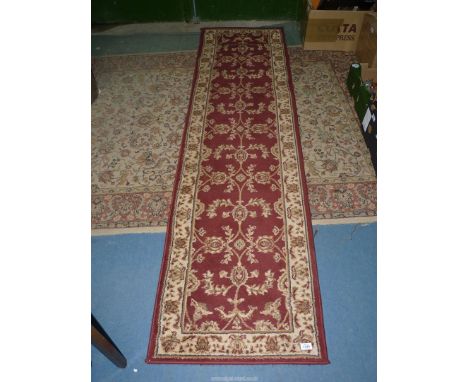 A red runner/rug, 24" wide x 91 1/2" long.