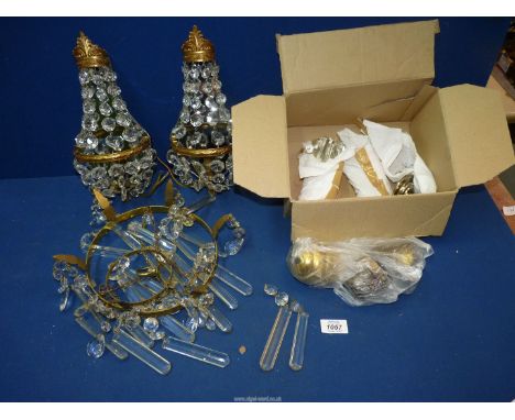 A two tier crystal chandelier (some droppers missing), a pair of mirror backed electric wall lights with droppers and fitting
