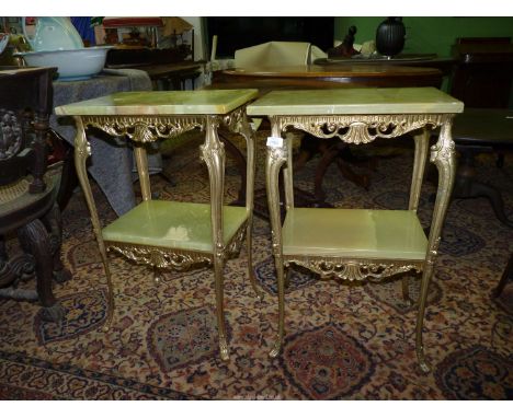A pair of rectangular Onyx topped occasional tables standing on brass/Ormolu legs with scroll details and united by a lower s