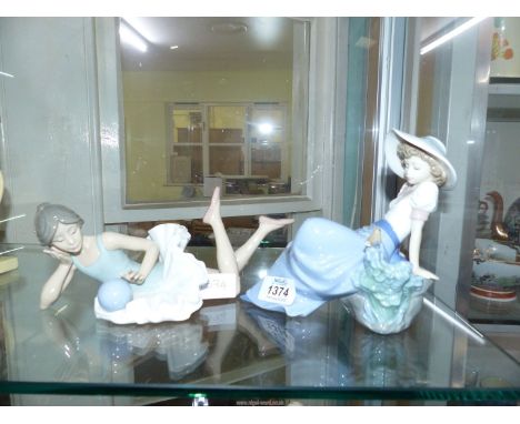 Two Nao figurines of young girls (bird tail chipped to one figure).