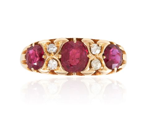 AN ANTIQUE RUBY AND DIAMOND FIVE STONE RING, 1904 in 18ct yellow gold, set with a trio of graduated oval cut rubies punctuate
