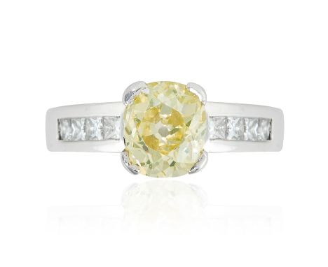 A 1.66 CARAT FANCY GREENISH YELLOW DIAMOND RING in platinum, set with a cushion cut fancy greenish yellow diamond of approxim