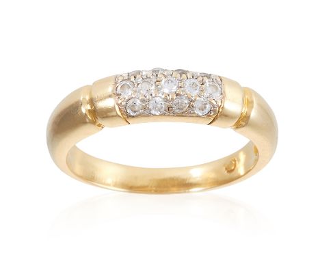A PAVE SET CUBIC ZIRCONIA PANEL RING, in yellow gold, with grooved sides, set with round cut cubic zirconia, marked indistinc