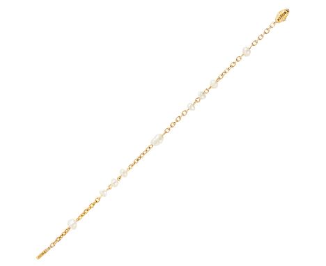 A NATURAL PEARL BRACELET in 14ct yellow gold, set with nine natural pearls on gold chain, stamped 585, 19cm, 6.36g.