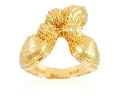 A 'SCARF' DRESS RING in 18ct yellow gold, the stylised design depicting a scarf knotted together in a bow, full British hallm