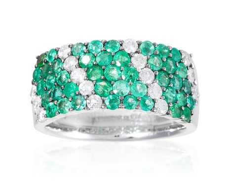 AN EMERALD AND DIAMOND DRESS RING in 18ct white gold, jewelled with round cut diamonds and emeralds, stamped 750, size n / 6.