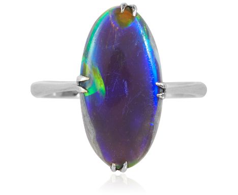 AN OPAL DRESS RING in yellow gold, set with a marquise black opal, stamped 9K, size O / 7, 2.6g.