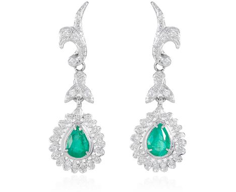 A PAIR OF EMERALD AND DIAMOND DROP EARRINGS, in 18ct white gold, the pear cut emeralds suspended bellow diamond foliate motif